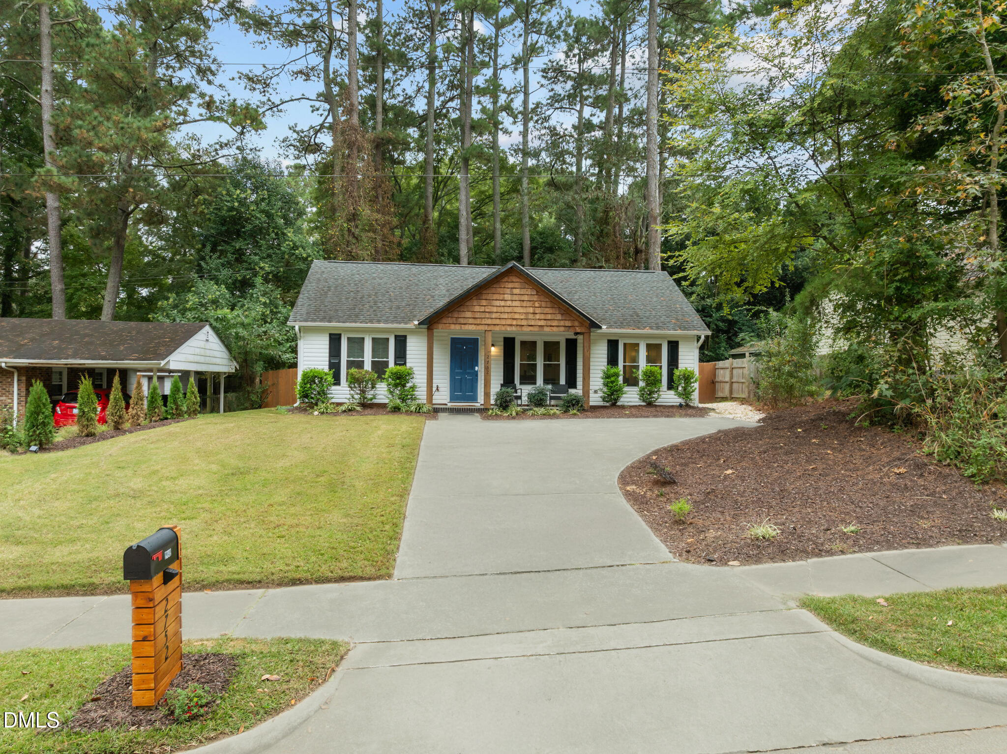 2752 Milburnie Road Raleigh, NC 27610 - Photo 3 of 54 a front view of a house with a yard
