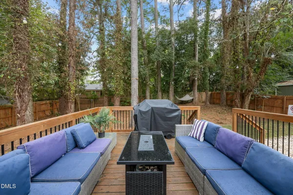 a view of backyard with plants and outdoor seating