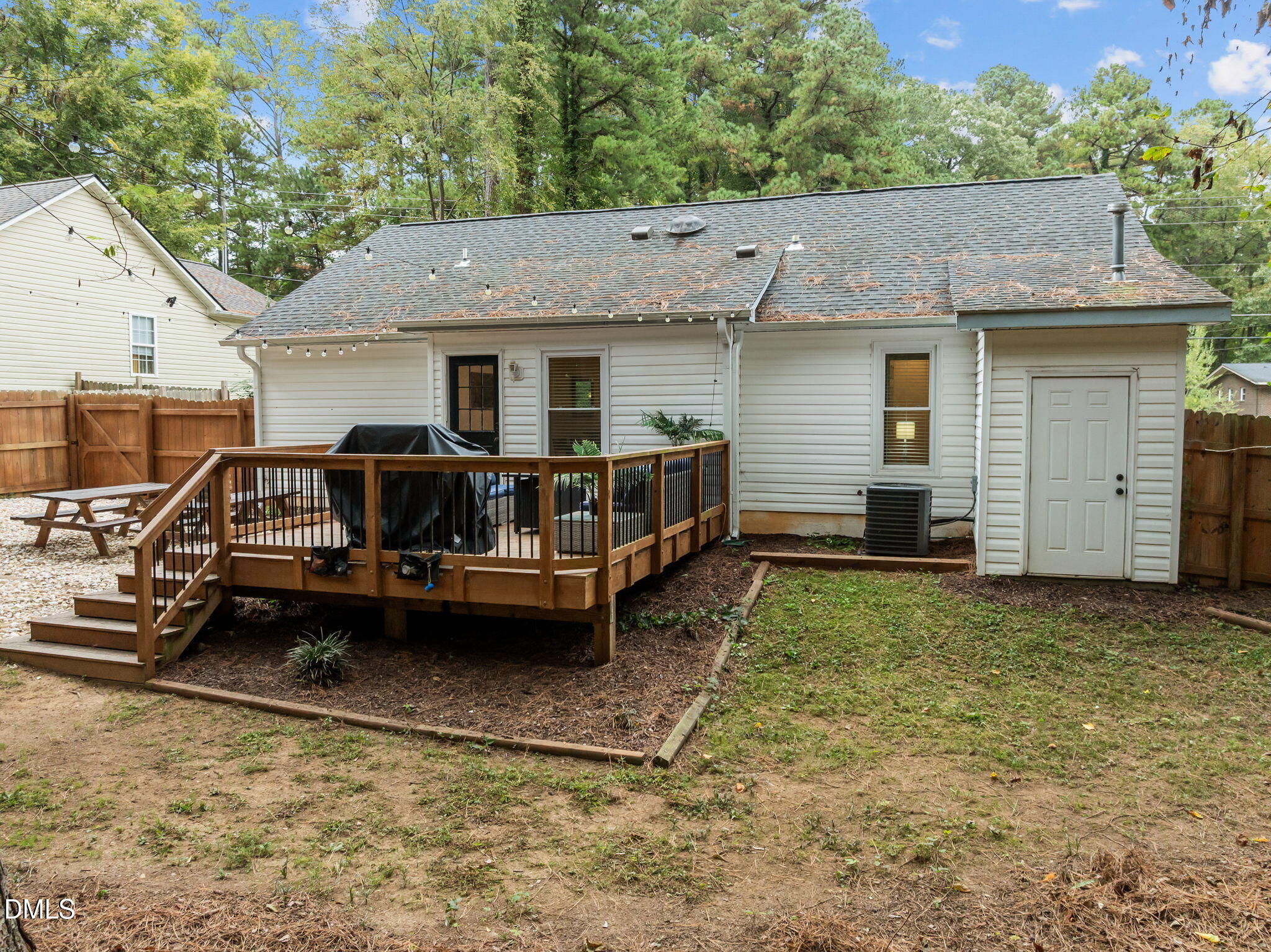 2752 Milburnie Road Raleigh, NC 27610 - Photo 39 of 54 a view of a house with a yard and roof