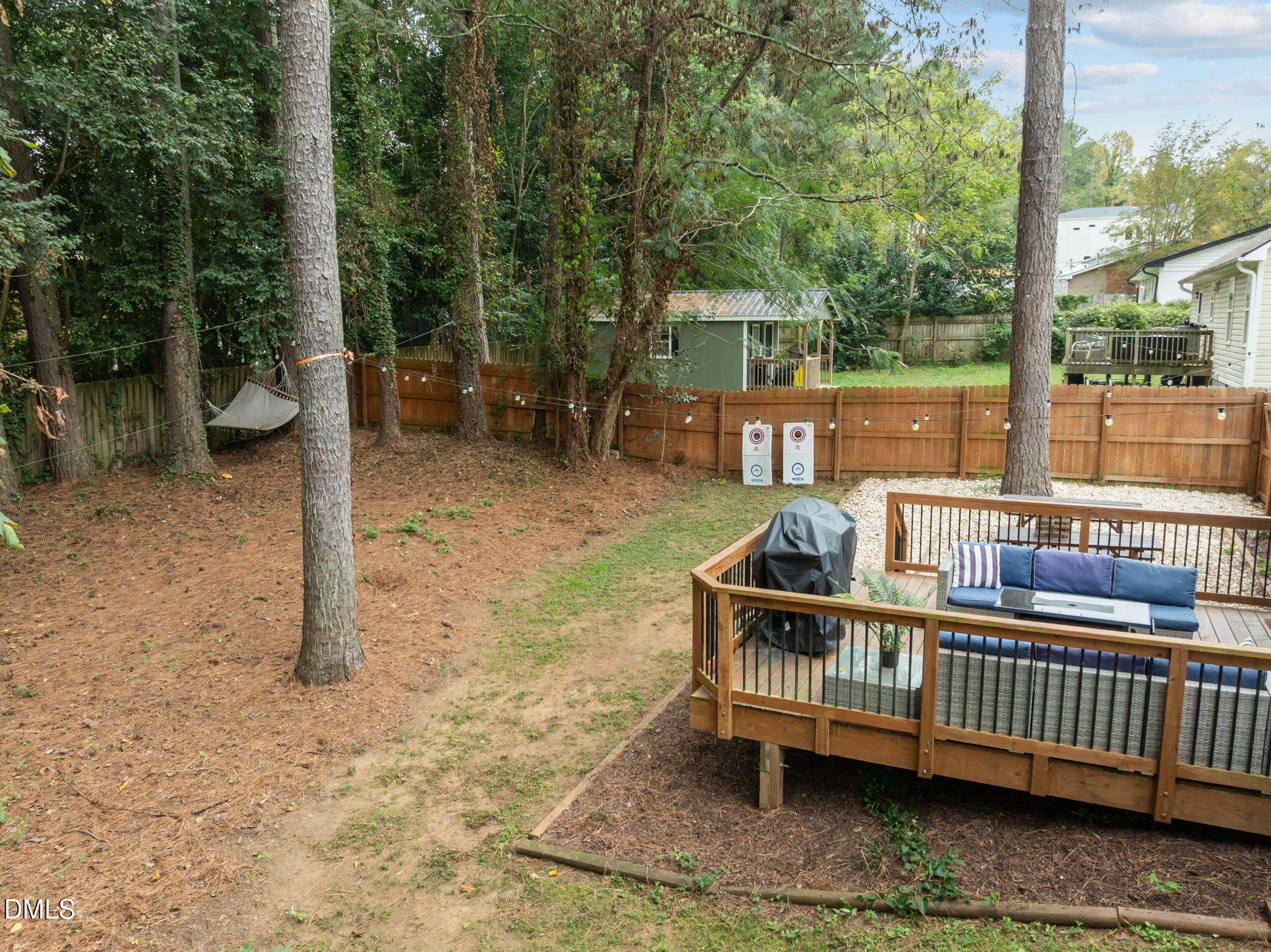 2752 Milburnie Road Raleigh, NC 27610 - Photo 40 of 54 a view of a deck with furniture and garden
