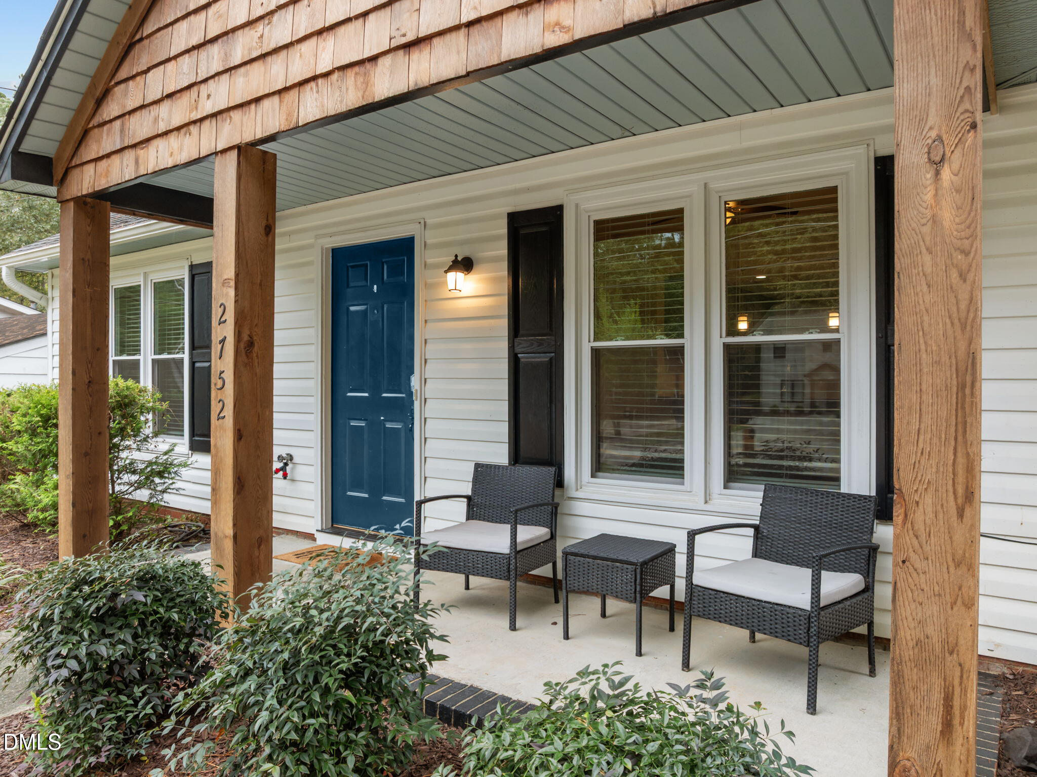 2752 Milburnie Road Raleigh, NC 27610 - Photo 4 of 54 a view of a patio with couple of chairs and a potted plant