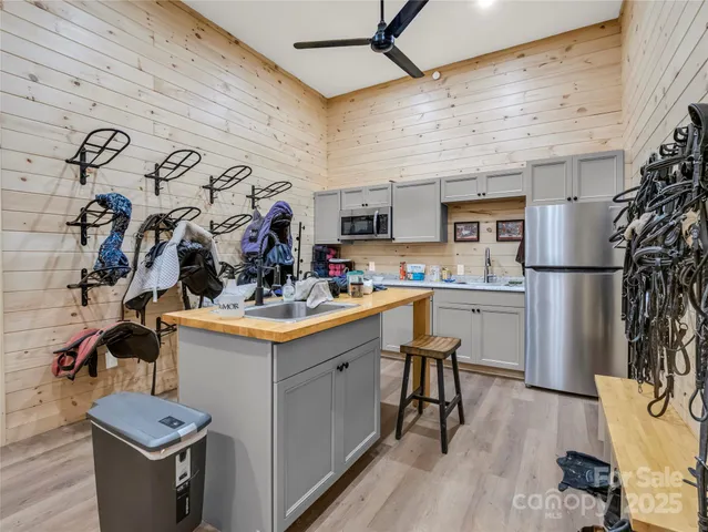 a kitchen with a sink appliances and cabinets