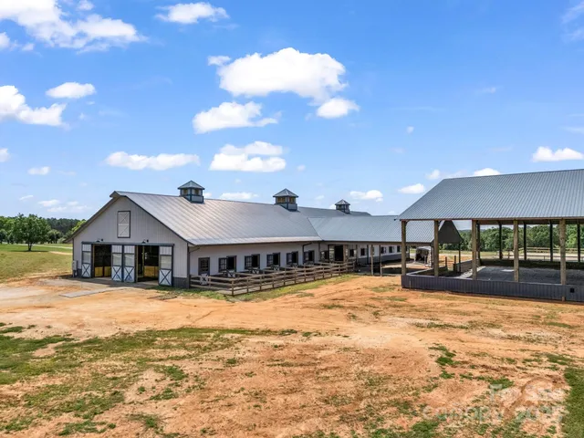 a view of a house with a yard covered with snow in front of house