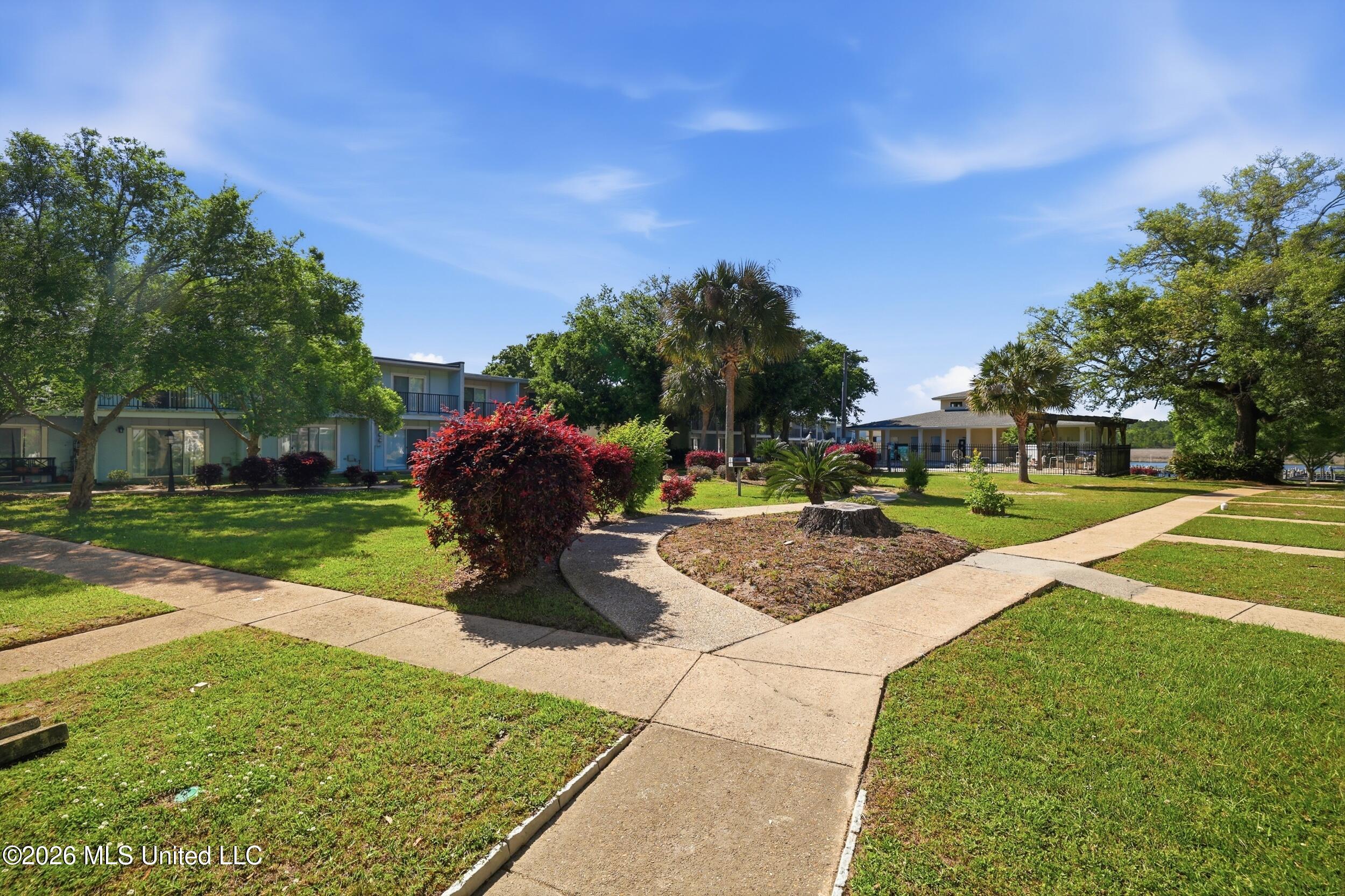 3230 Cumberland Road, Unit 41 Ocean Springs, MS 39564 - Photo 28 of 43 WALKING PATH TO CLUB HOUSE AND BAYOUg