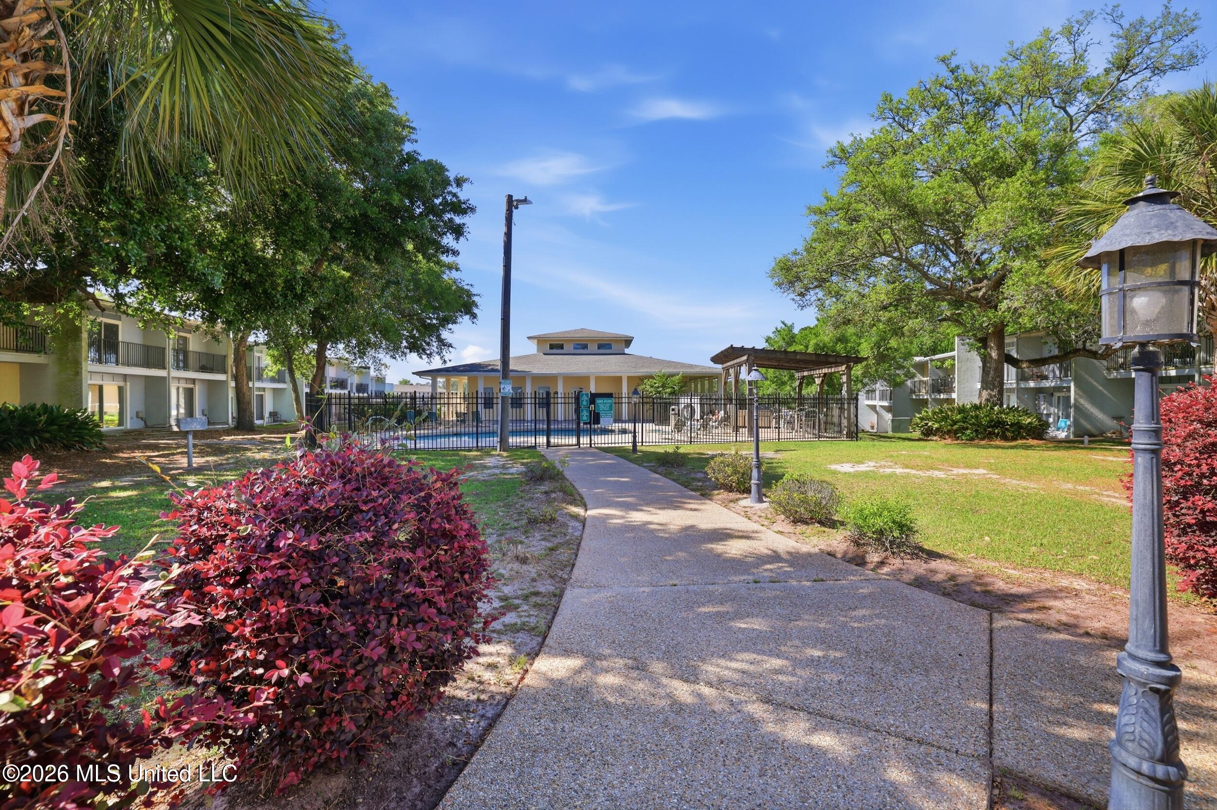 3230 Cumberland Road, Unit 41 Ocean Springs, MS 39564 - Photo 30 of 43 PATH TO POOL AND CLUB HOUSE