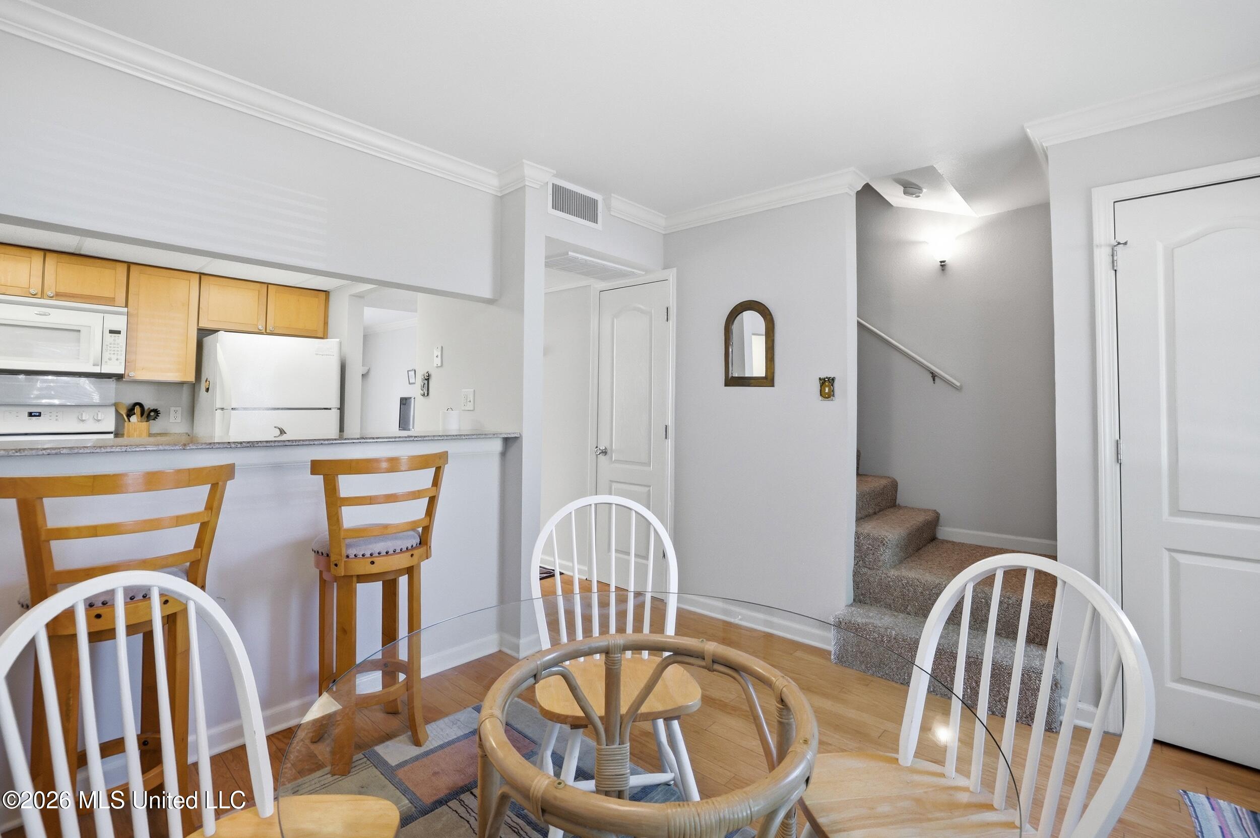 3230 Cumberland Road, Unit 41 Ocean Springs, MS 39564 - Photo 7 of 43 DINING HEADING UPSTAIRS