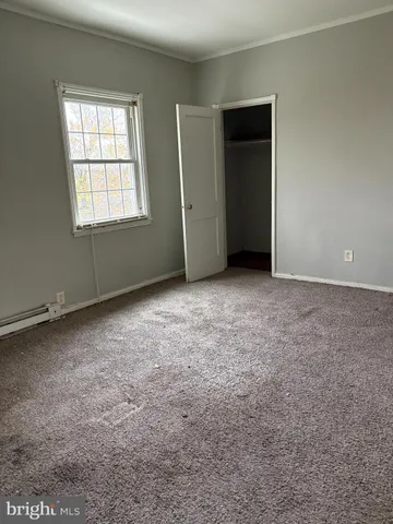 a view of gallery with wooden floor