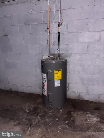 a view of a brick house with a small yard