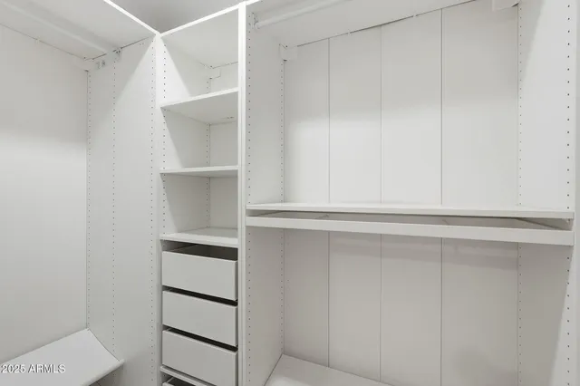 an aerial view of residential houses with outdoor space and river