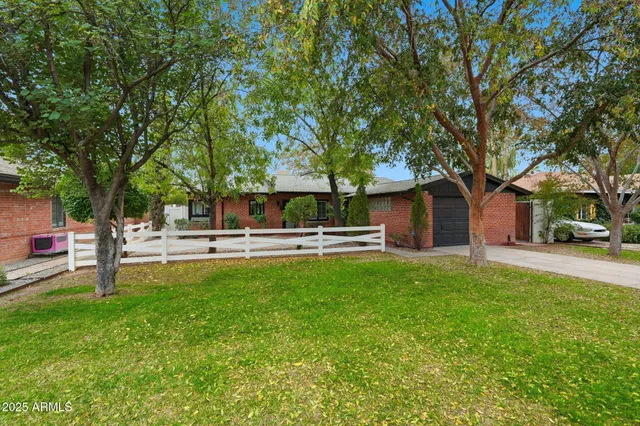 a kitchen with a stove a sink and a refrigerator