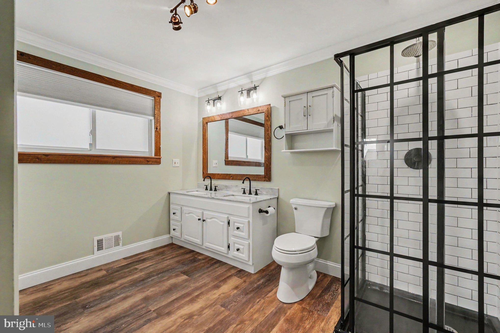 201 Mountain Road Fallston, MD 21047 - Photo 18 of 35 a bathroom with a toilet sink and mirror