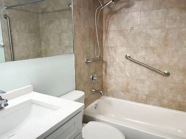a bathroom with a sink a toilet and a bathtub