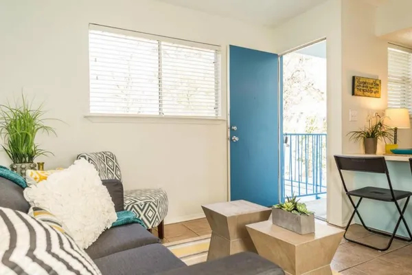 a living room with furniture and a window