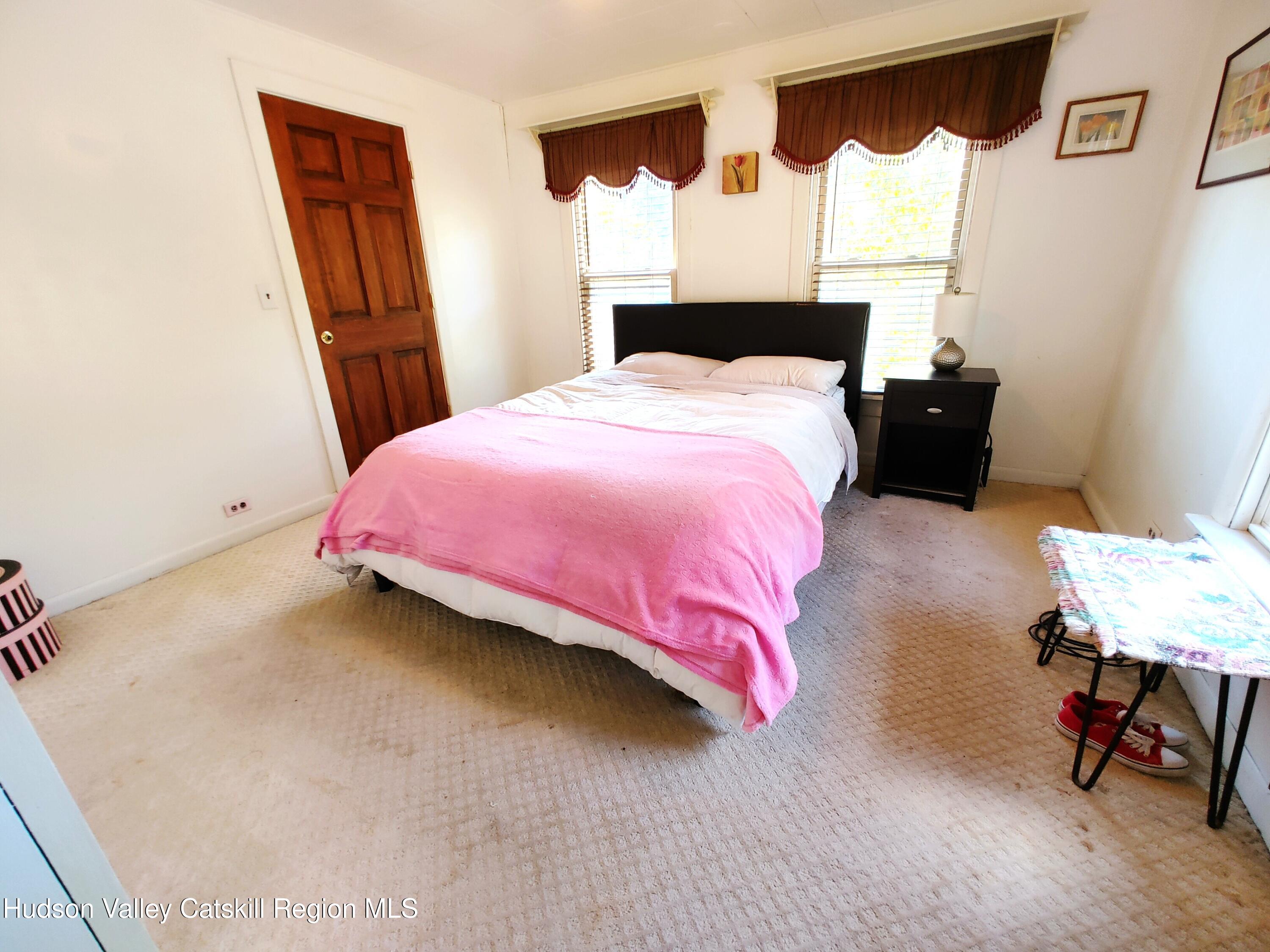 11 Old Turnpike Road Pine Hill, NY 12465 - Photo 11 of 64 a bedroom with a bed and a lamp on table