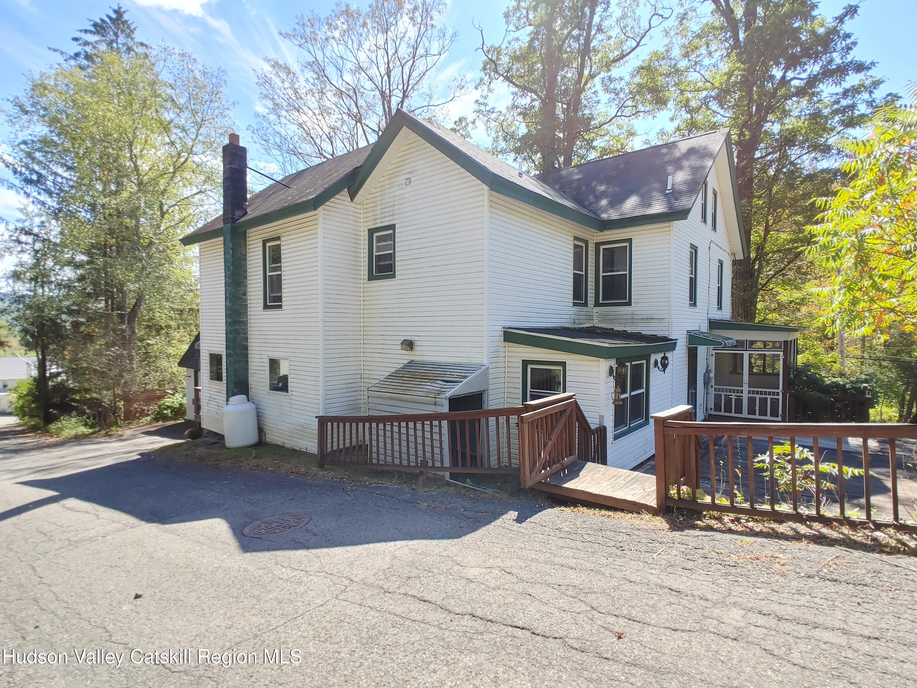 11 Old Turnpike Road Pine Hill, NY 12465 - Photo 16 of 64 a view of a house with a yard and sitting area