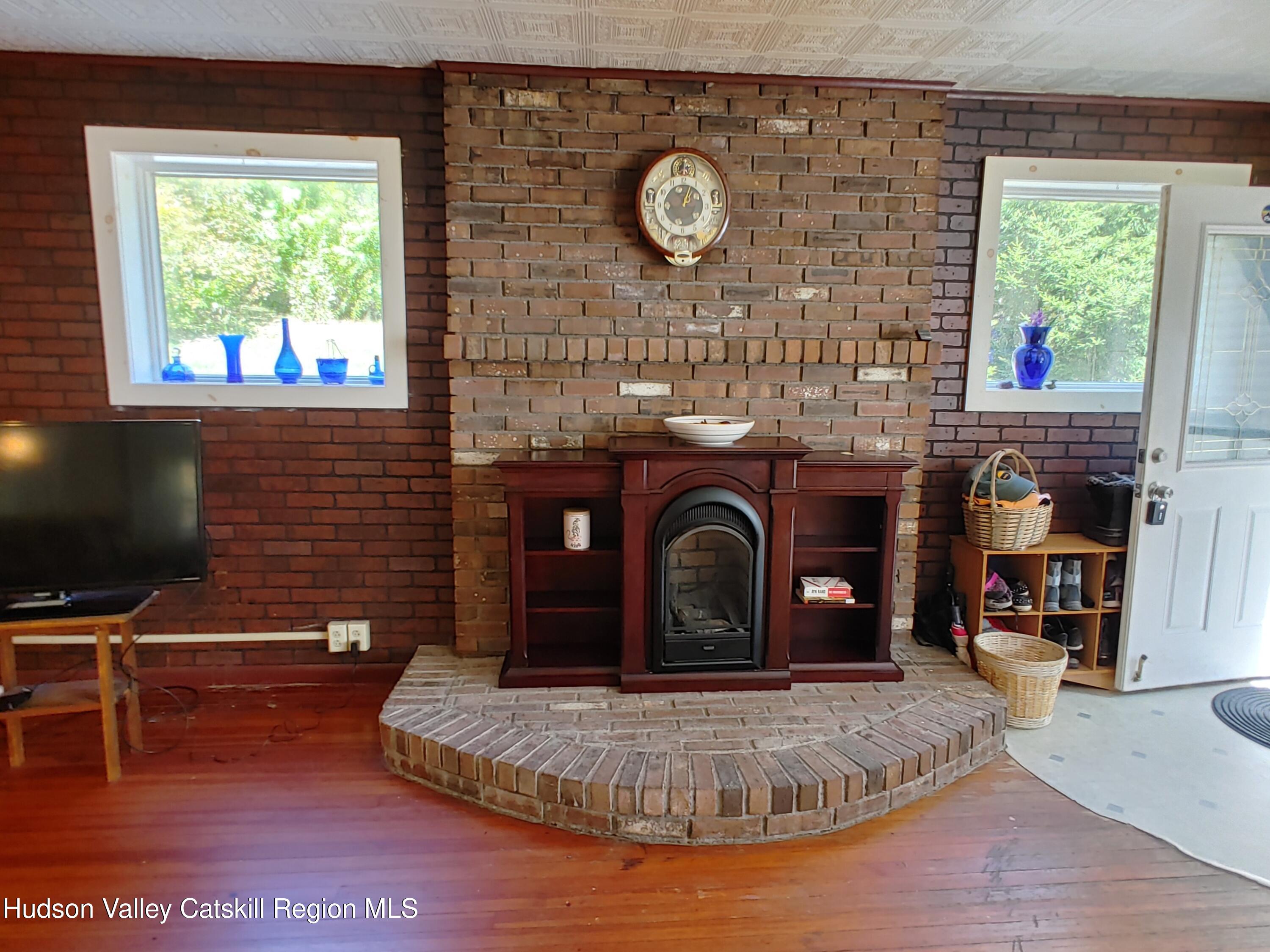 11 Old Turnpike Road Pine Hill, NY 12465 - Photo 19 of 64 a living room with furniture and a fireplace