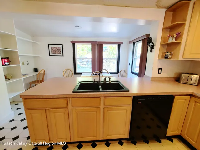 a view of an empty room and wooden floor
