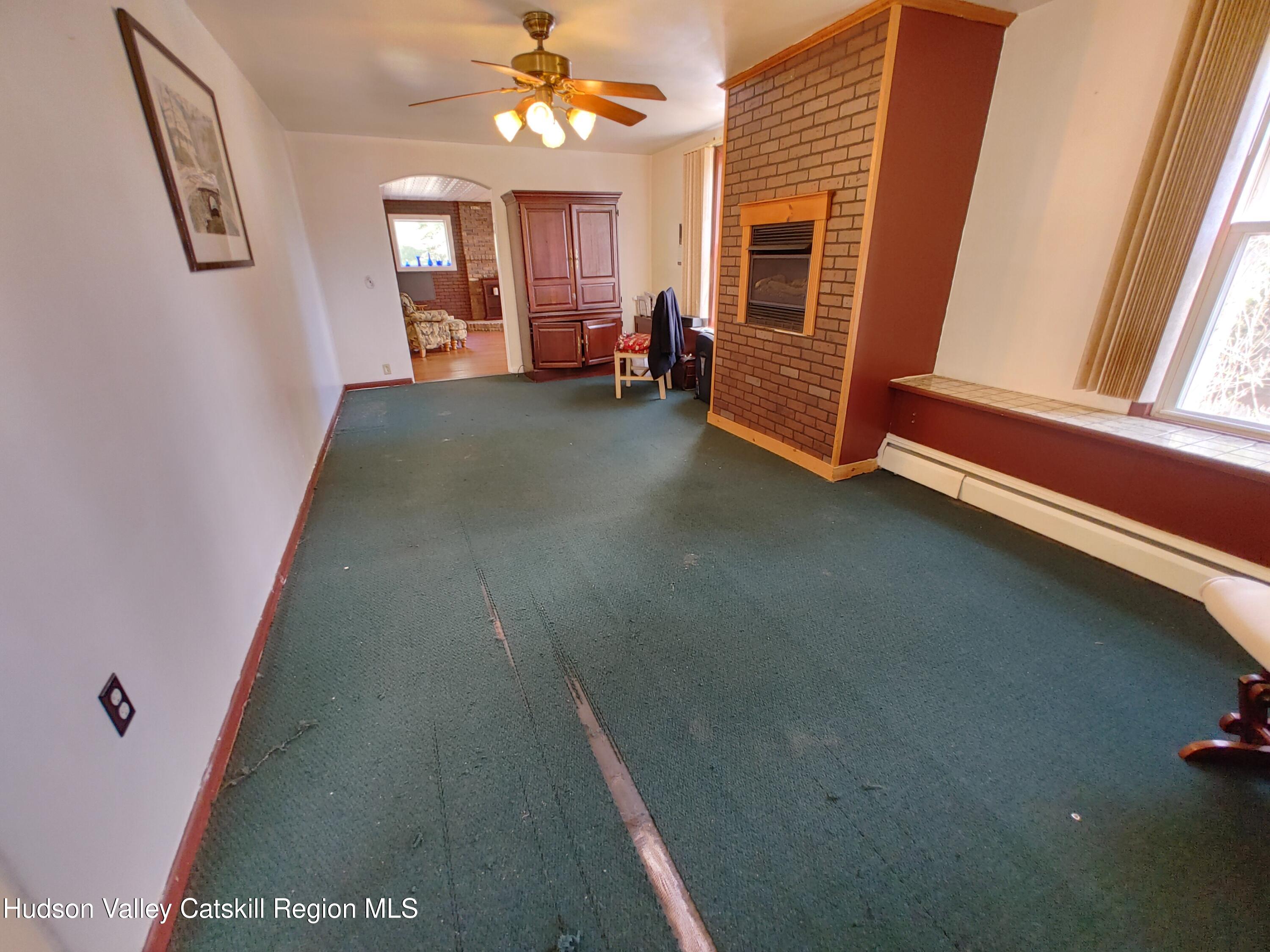 11 Old Turnpike Road Pine Hill, NY 12465 - Photo 26 of 64 a view of a livingroom with furniture staircase and windows