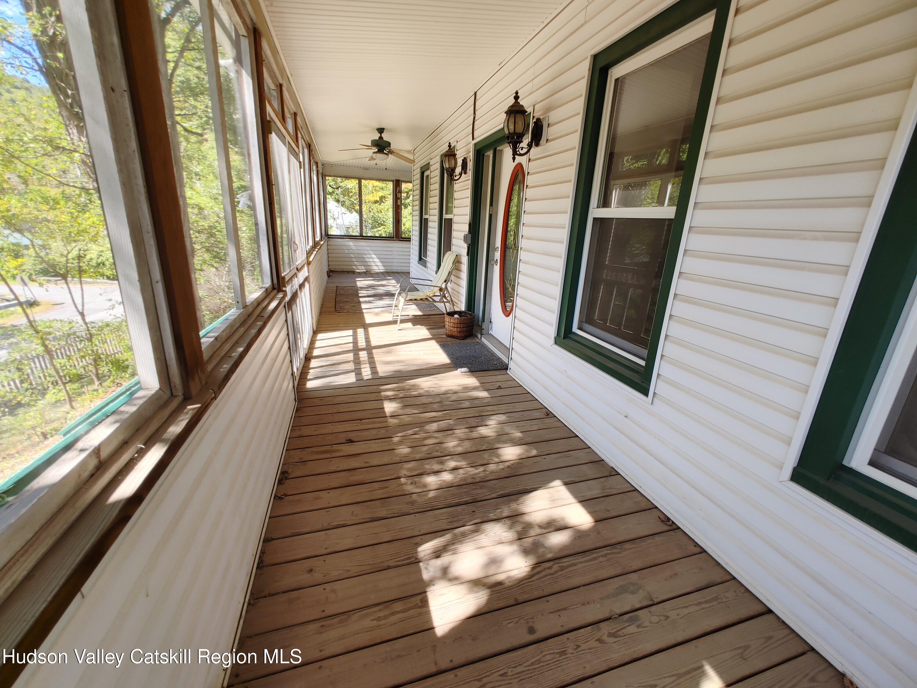 11 Old Turnpike Road Pine Hill, NY 12465 - Photo 27 of 64 a view of a balcony with wooden floor and furniture
