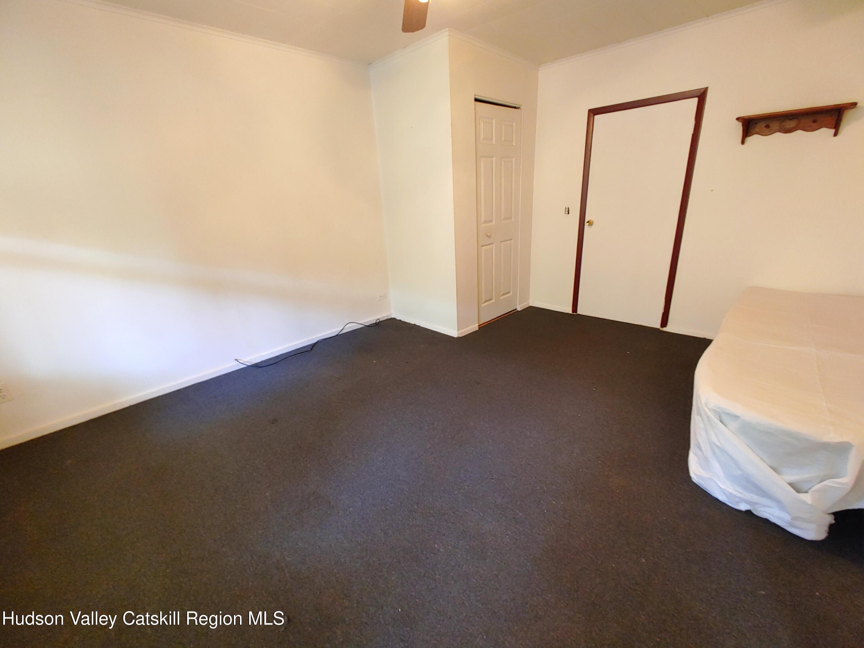11 Old Turnpike Road Pine Hill, NY 12465 - Photo 28 of 64 a view of an empty room and wooden floor