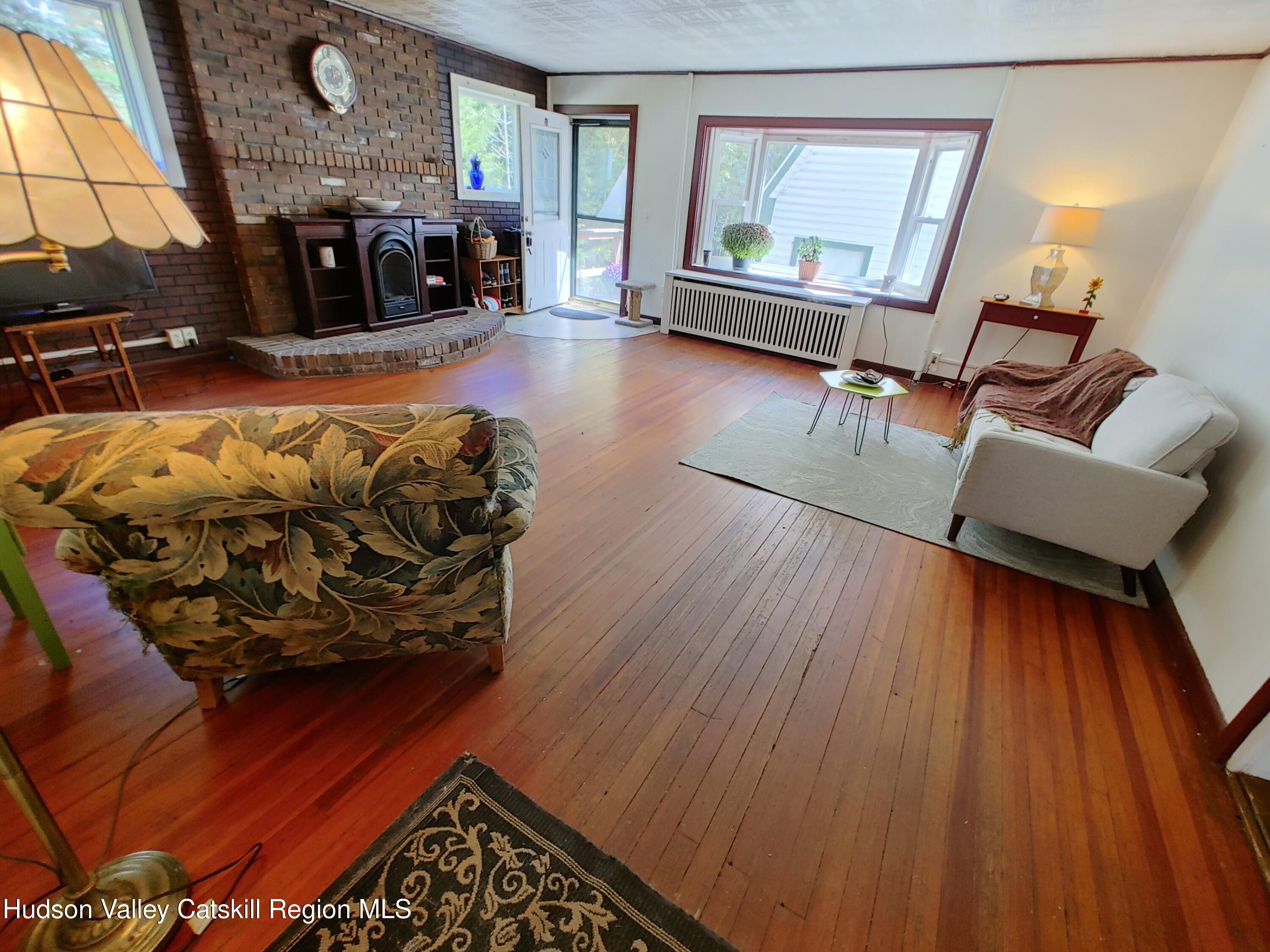11 Old Turnpike Road Pine Hill, NY 12465 - Photo 3 of 64 a living room with furniture and a fireplace