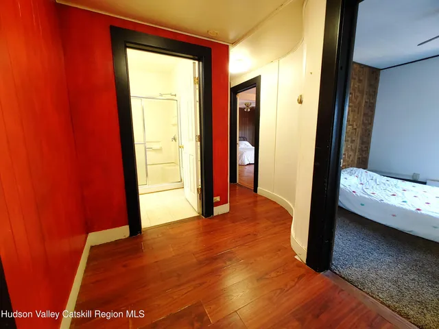 a view of a bedroom from a hallway