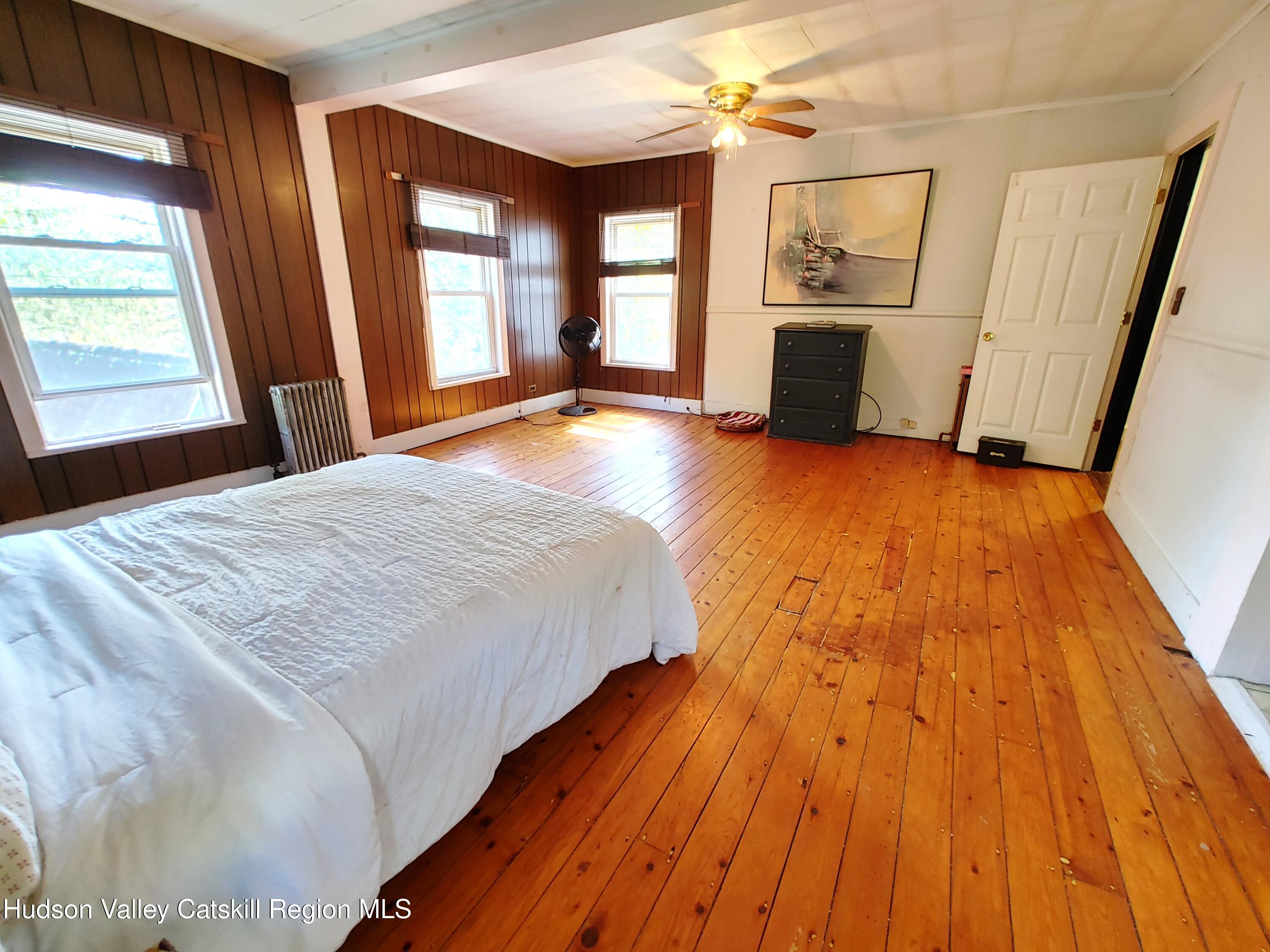 11 Old Turnpike Road Pine Hill, NY 12465 - Photo 37 of 64 a bed sitting in a spacious bedroom next to a window