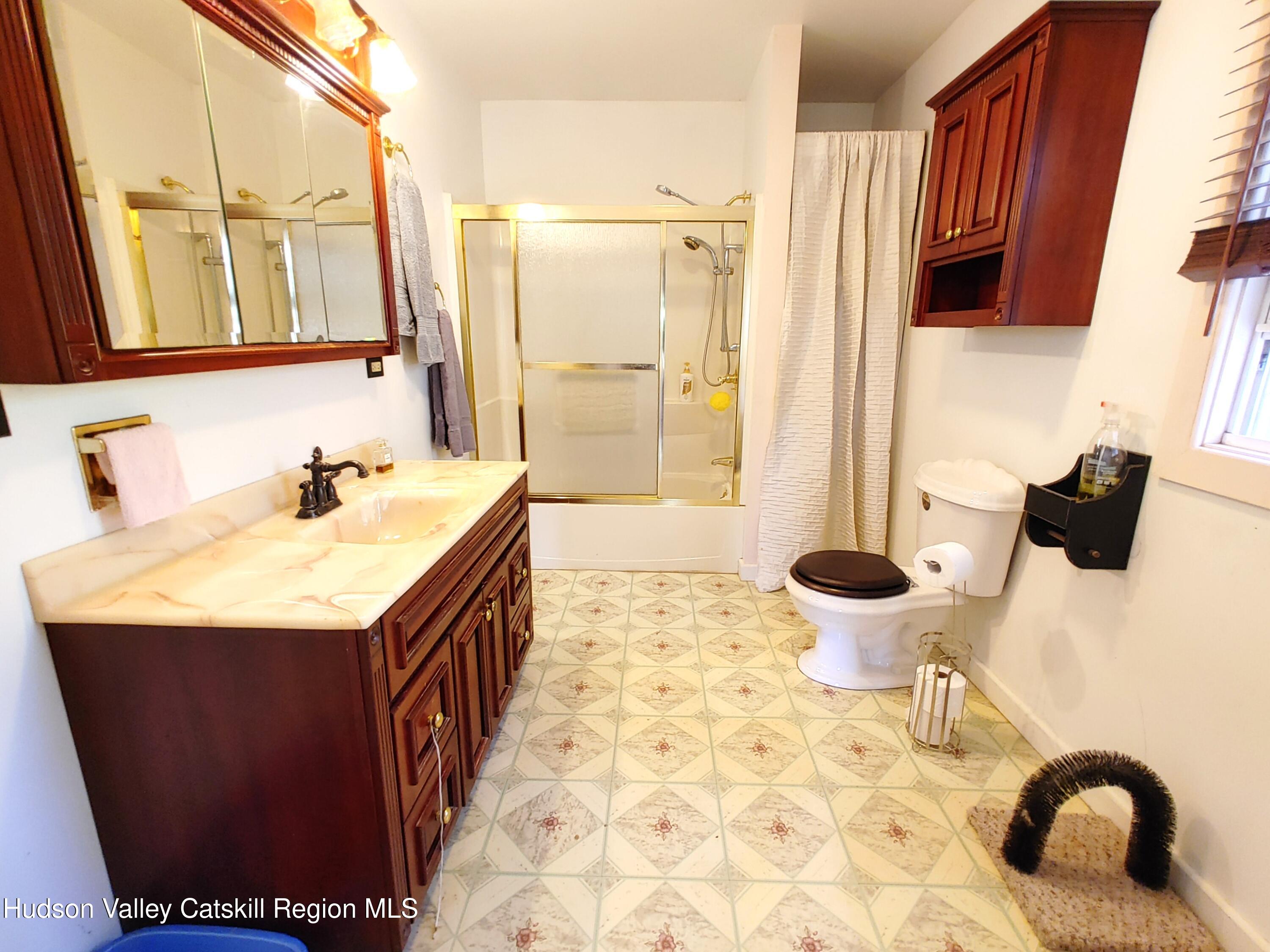 11 Old Turnpike Road Pine Hill, NY 12465 - Photo 9 of 64 a bathroom with a sink and a mirror