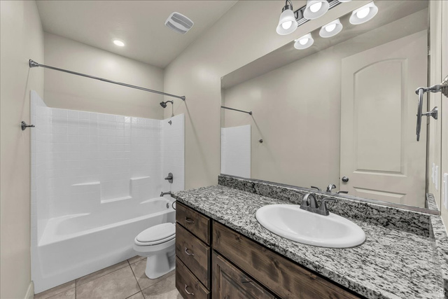 794 North Via Modelo Circle Washington, UT 84780 - Photo 13 of 21 Full bathroom with vanity, bathtub / shower combination, light tile patterned floors, and recessed lighting