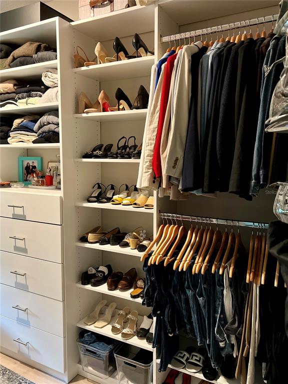 1266 Spotted Sandpiper Loop Winter Springs, FL 32708 - Photo 14 of 21 a view of walk in closet with clothes and shoes