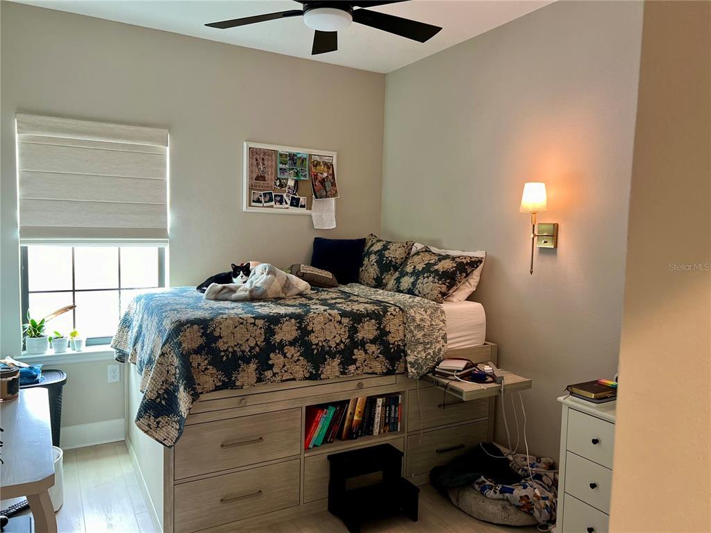 1266 Spotted Sandpiper Loop Winter Springs, FL 32708 - Photo 20 of 21 a bed sitting in a bedroom next to a window