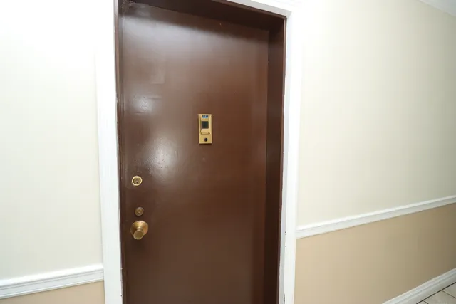 a living room with furniture and a lamp