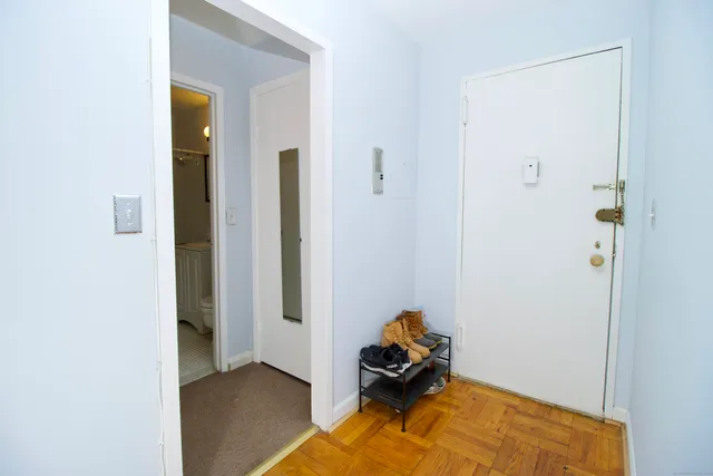 a utility room with cabinets washer and dryer