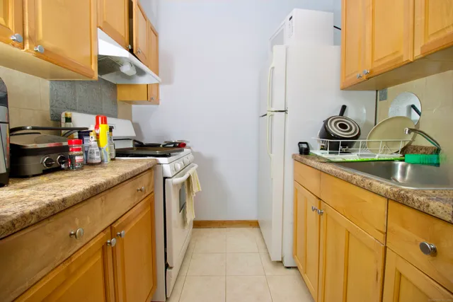 a bathroom with a sink a toilet and bathtub