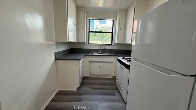 a kitchen with a sink and a window