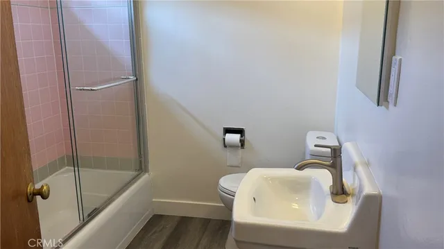 a bathroom with a sink and toilet