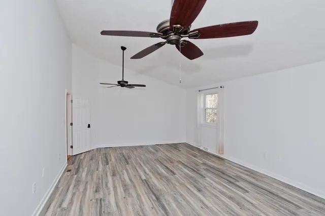 a bathroom with a double vanity sink mirror and shower