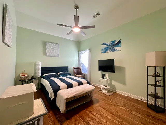 a bathroom with a sink vanity mirror and toilet
