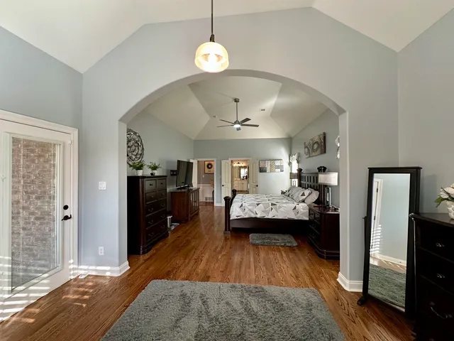 a living room with furniture rug and window