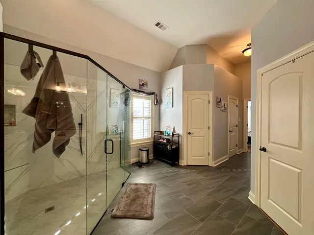 a bathroom with a sink vanity and a mirror