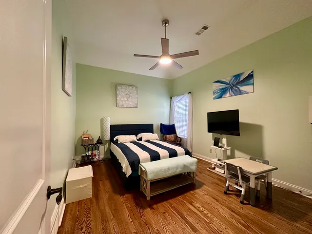 a bathroom with a shower and a sink mirror