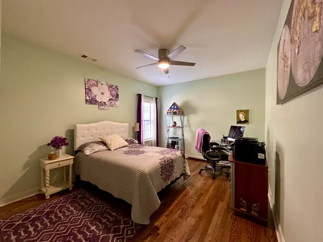 a bathroom with a sink a toilet a mirror and shower