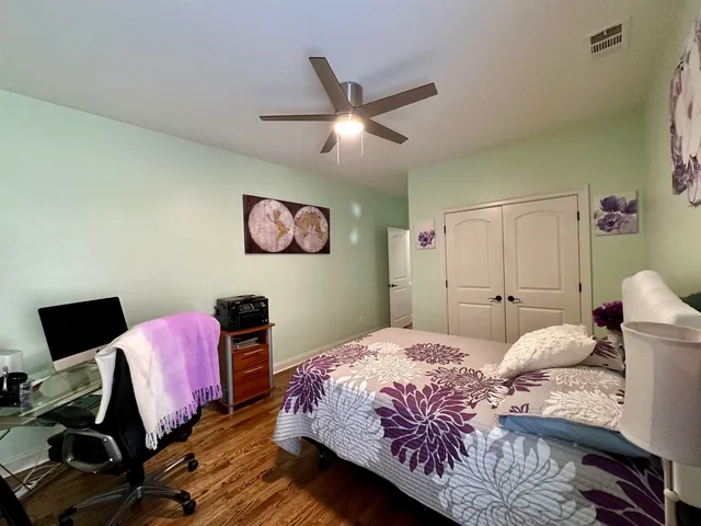 a bed room with a bed and a chandelier