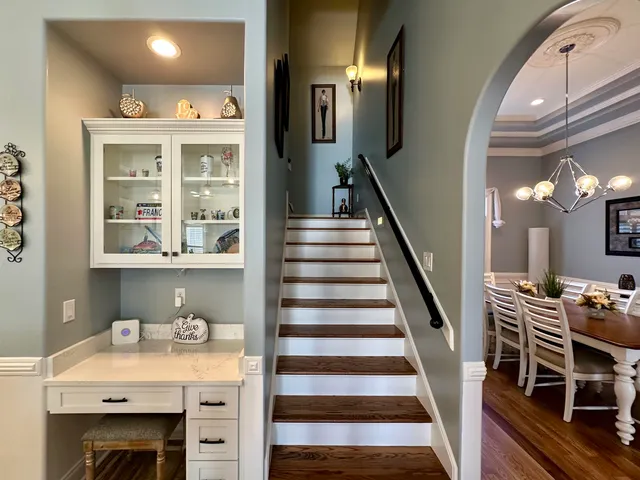 a bathroom with a glass shower door a bathtub a sink and a mirror