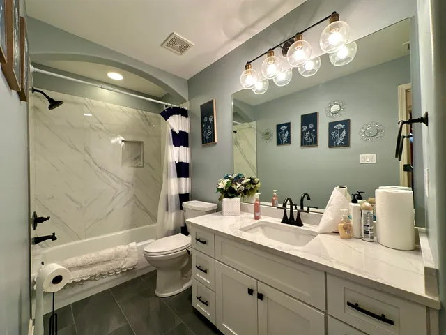 a room with pool table wooden floor and window
