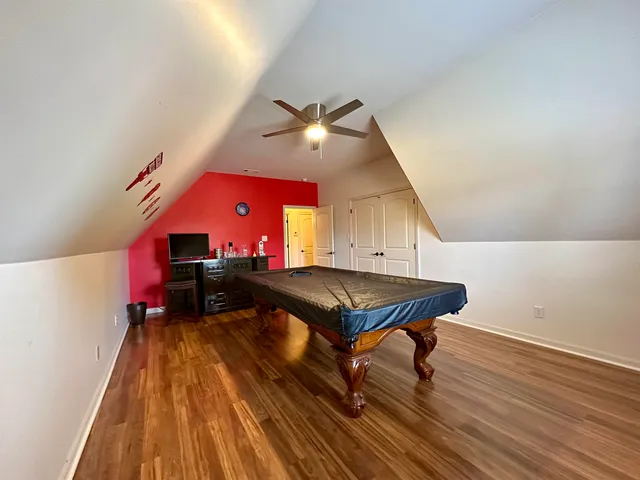 a room with furniture and wooden floor