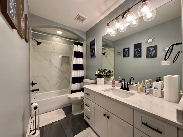 a room with pool table wooden floor and window