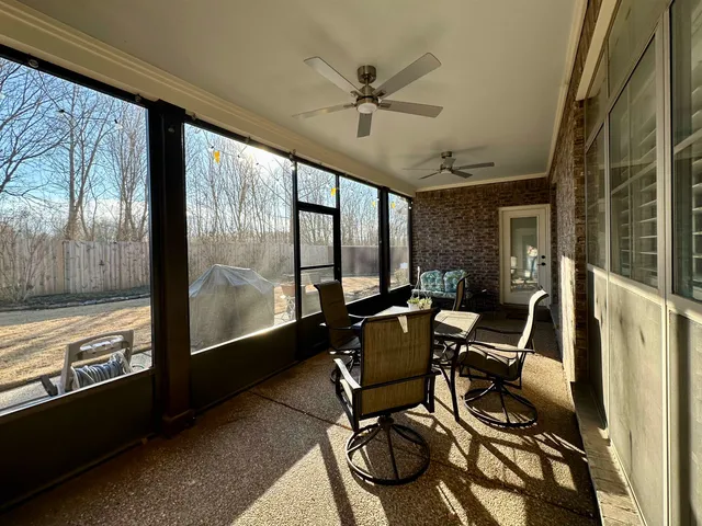 a view of workspace with wooden floor and windows