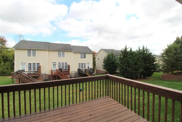 a view of a wooden deck and city view
