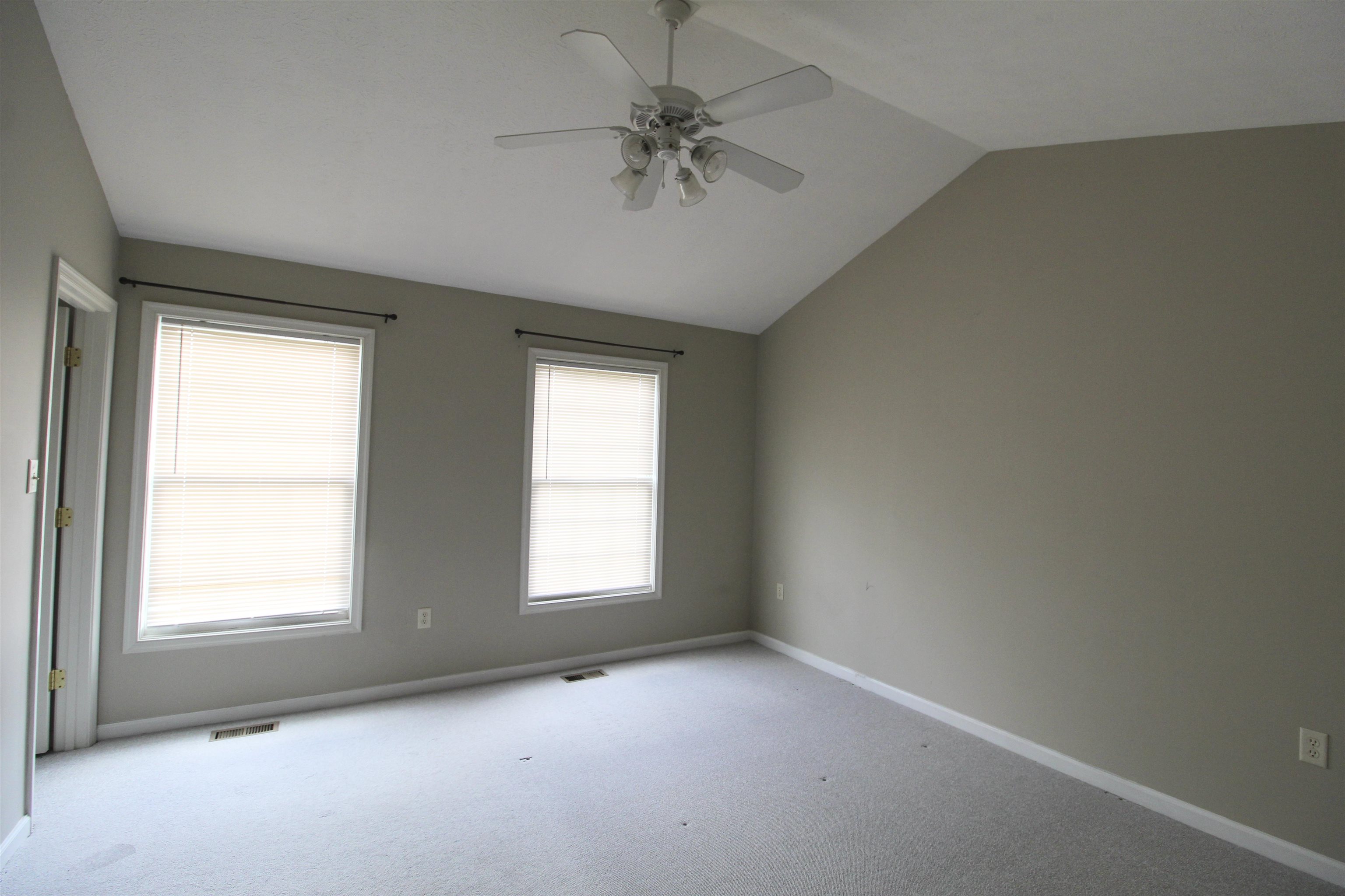 2881 Taylor Spring Lane Harrisonburg, VA 22801 - Photo 10 of 13 an empty room with a window and a ceiling fan